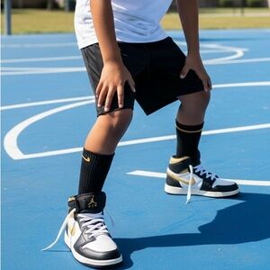 Nike Kids Black and White High-Top Sneakers with Gold Jumpman
